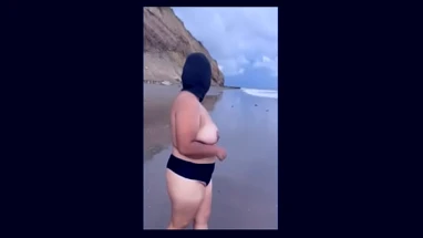 How nice - chubby Mexican girl strips naked on the beach
